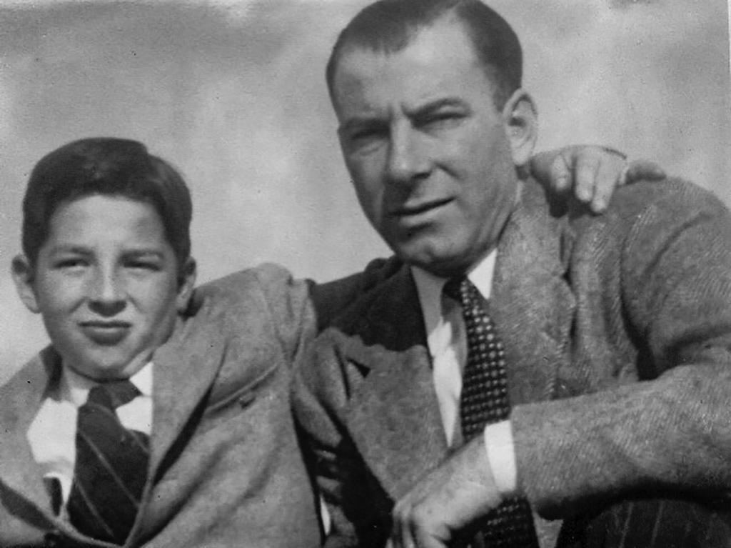Sam Calicura Jr. in a suit and tie with his young son Richard, also in a suit, early 1940s