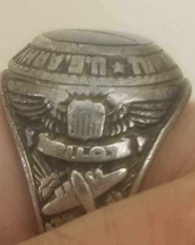 Silver Army Air Forces class ring, dark oval stone, eagle and shield, a banner reading PILOT, a four-engine bomber on the shank