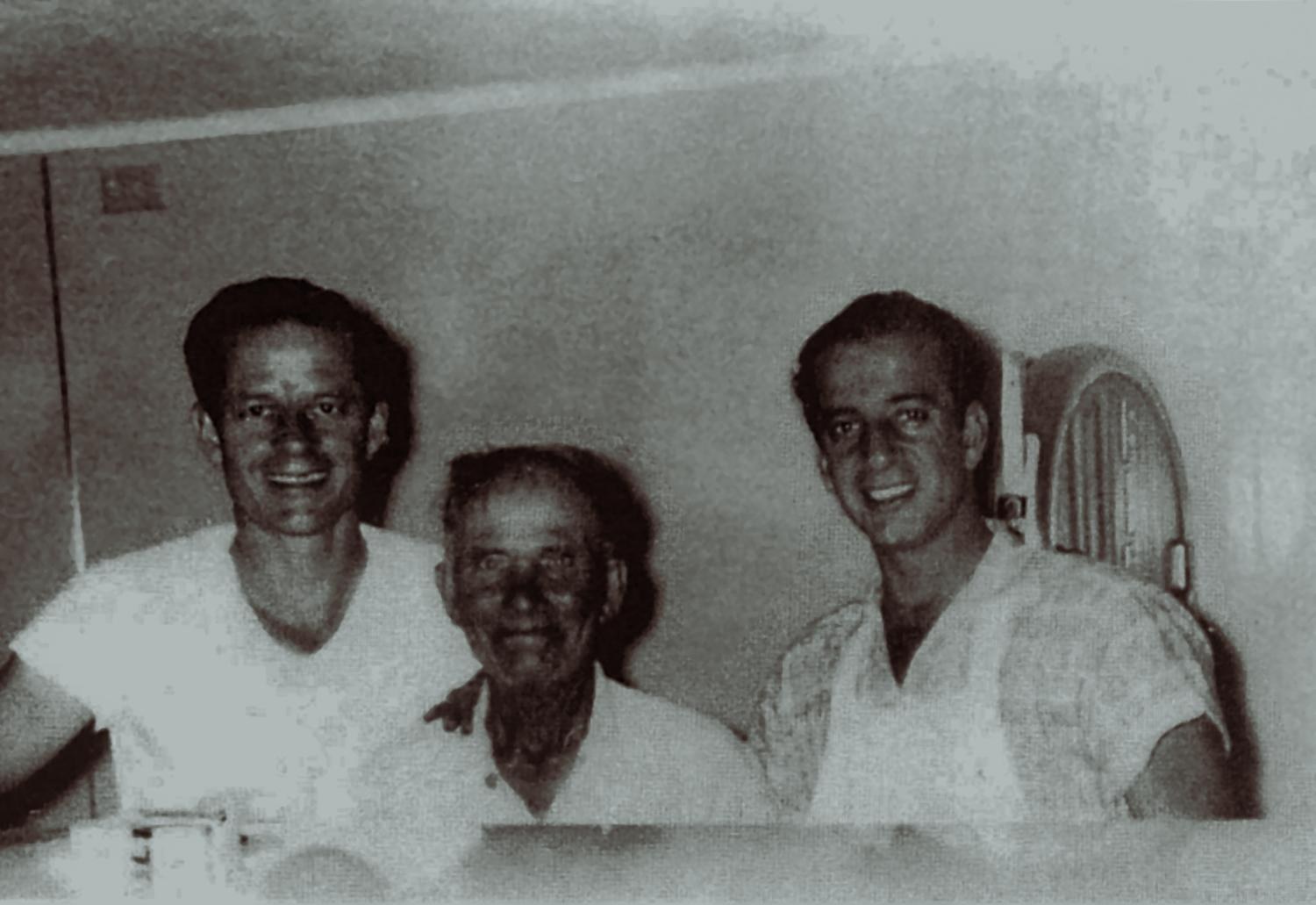 Frank Calicura, Sabato Rodia, and Bill Calicura sitting together, the older man in the middle