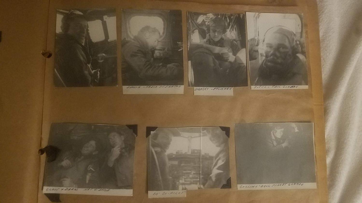 Seven small in-aircraft photographs of the Spirit of Martinez crew mounted on a paper album page, labeled in a family hand