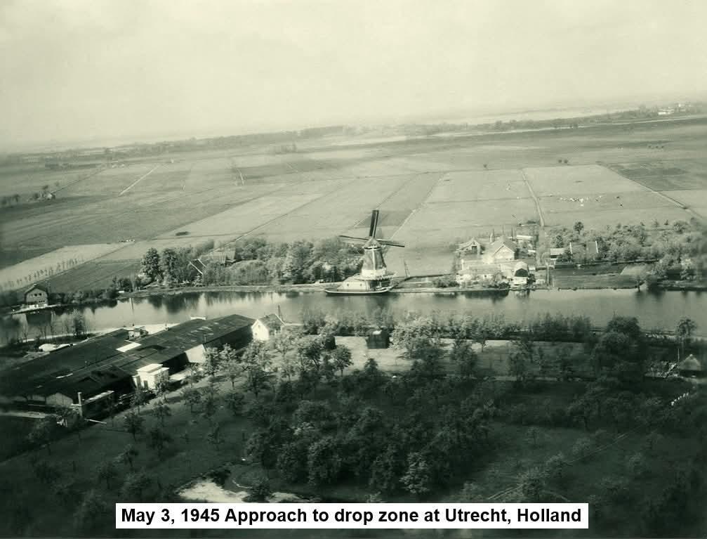 Aerial photograph of a Dutch mill on a canal, fields beyond, labeled May 3 1945 Approach to drop zone at Utrecht, Holland
